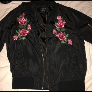 black bomber jacket with pink roses